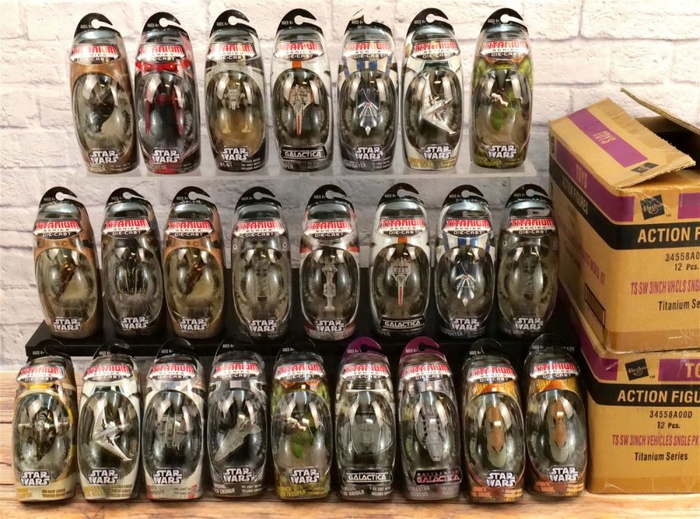 Lot 246: Two Cases of Star Wars & Battlestar Titanium 3" Vehicles - 24 Pcs