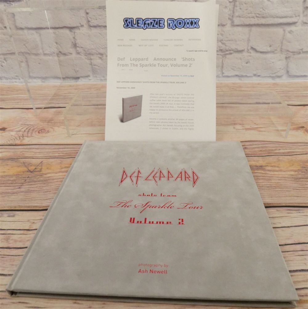 Lot 276: Def Leppard Autographed Hardcover Book