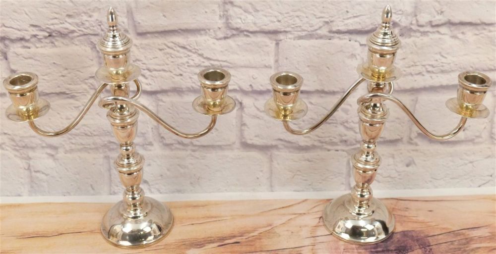 Lot 214: Pair of Sterling Weighted Candelabras