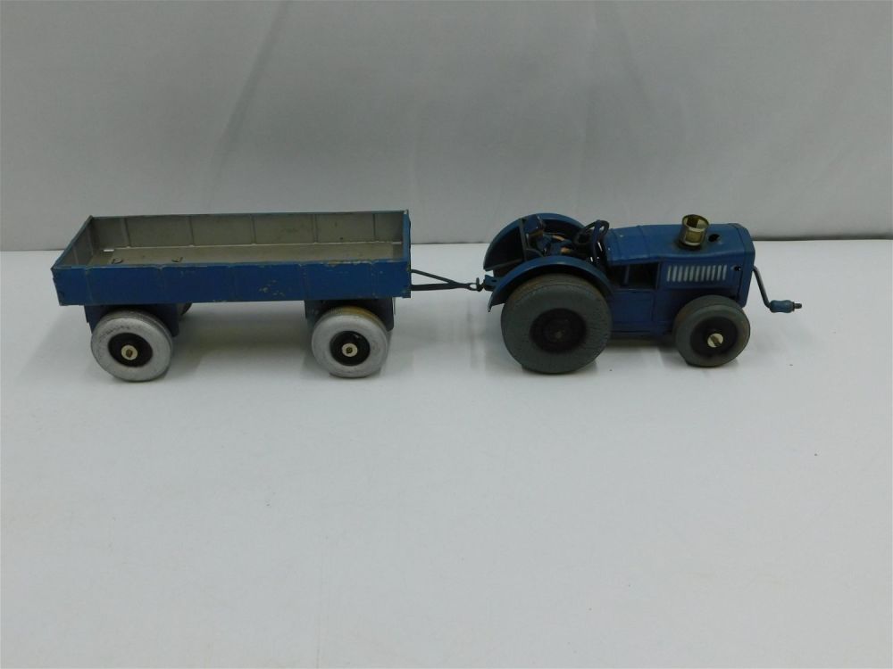 Lot 196: Vintage Tin Litho Wind Up Tractor with Pull Trailer