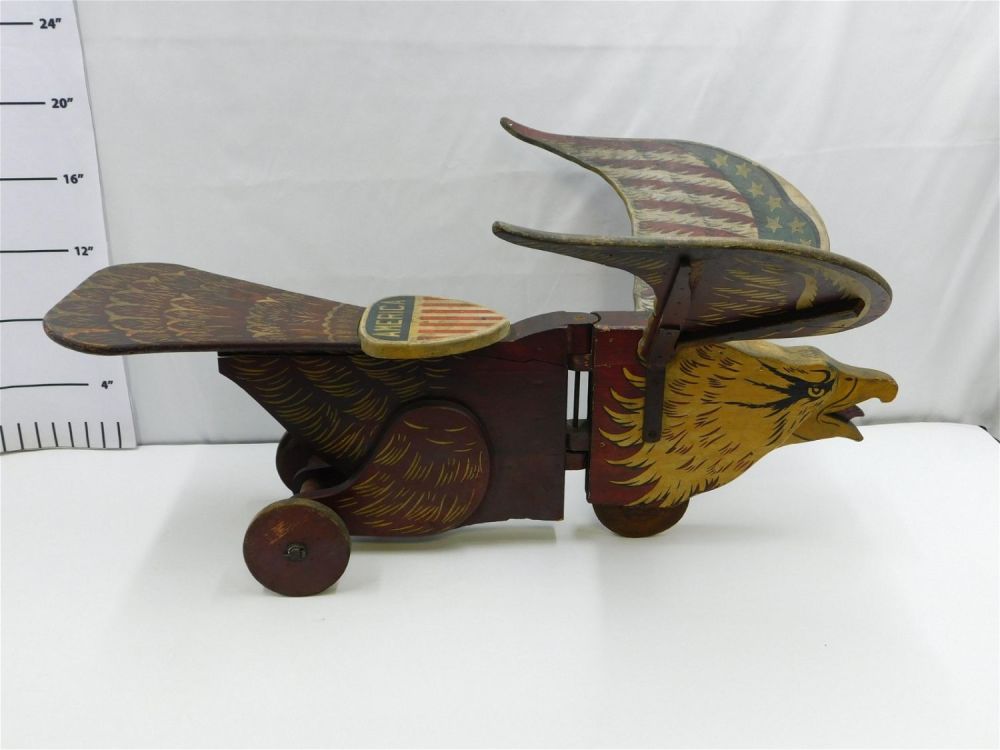 Lot 199: Antique Folk Art American Bald Eagle Wooden Ride On Car