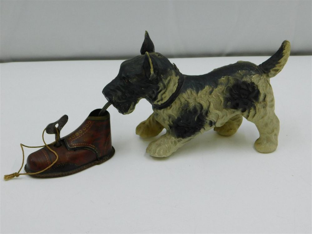 Lot 210: Vintage Tin Litho and Celluloid Dog with Shoe