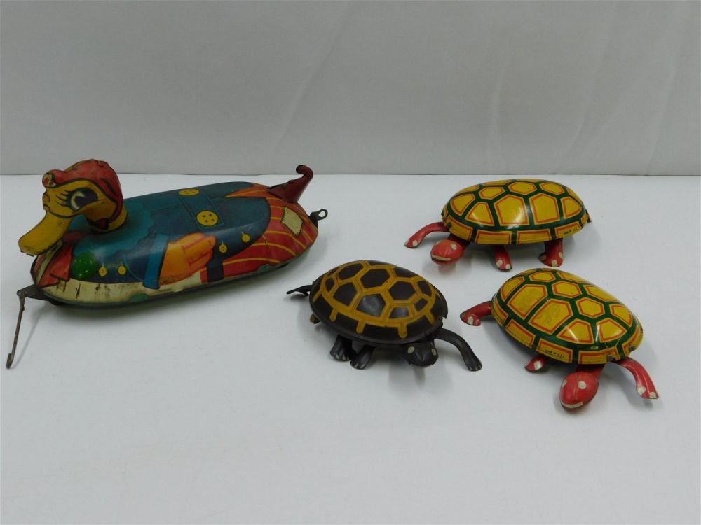 Lot 216: Lot of 4 Vintage Tin Litho Toys