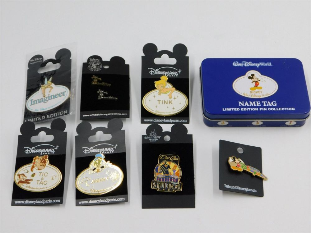 Lot 183: Lot of Disney Name Tag and International Disney Parks Pins