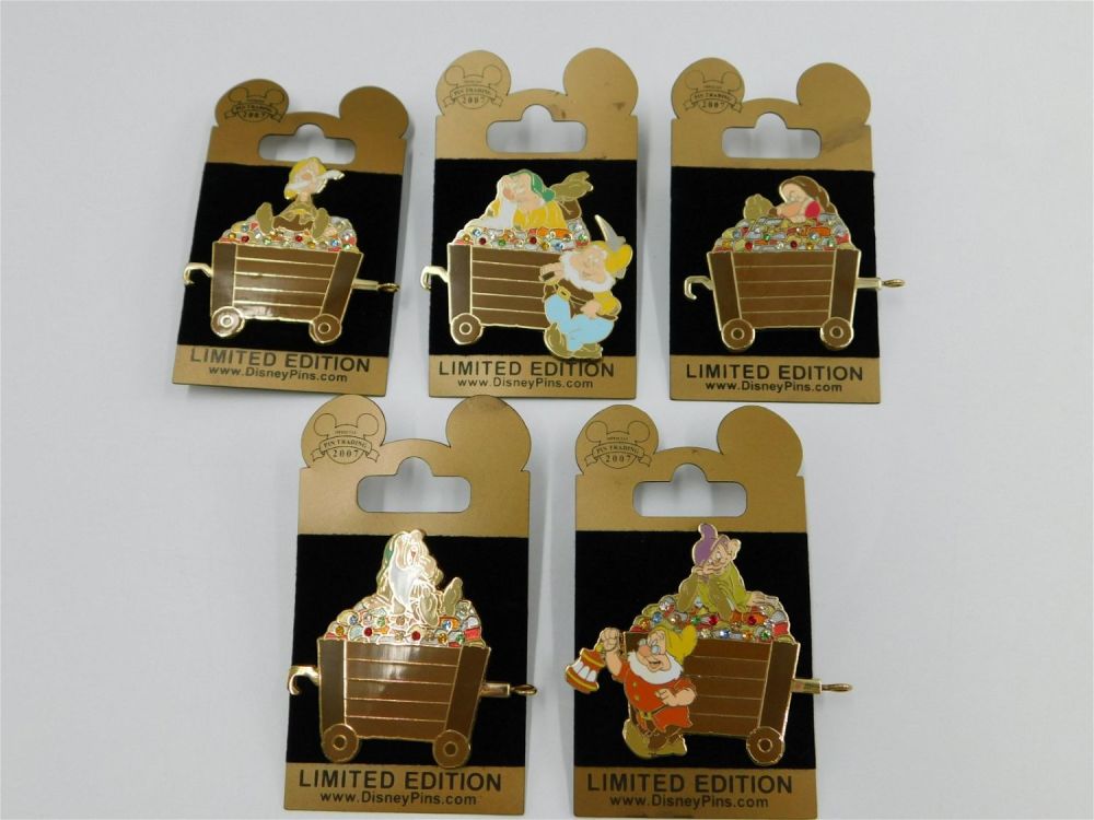 Lot 226: Disney Dwarfs Mine Car Pin Set - Gold Card Collection