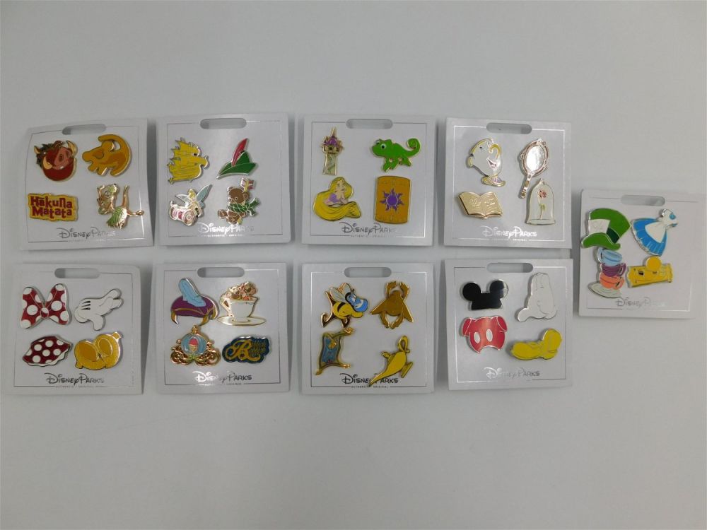 Lot 244: Lot of 9 Disney Parks 4 Pin Booster Sets
