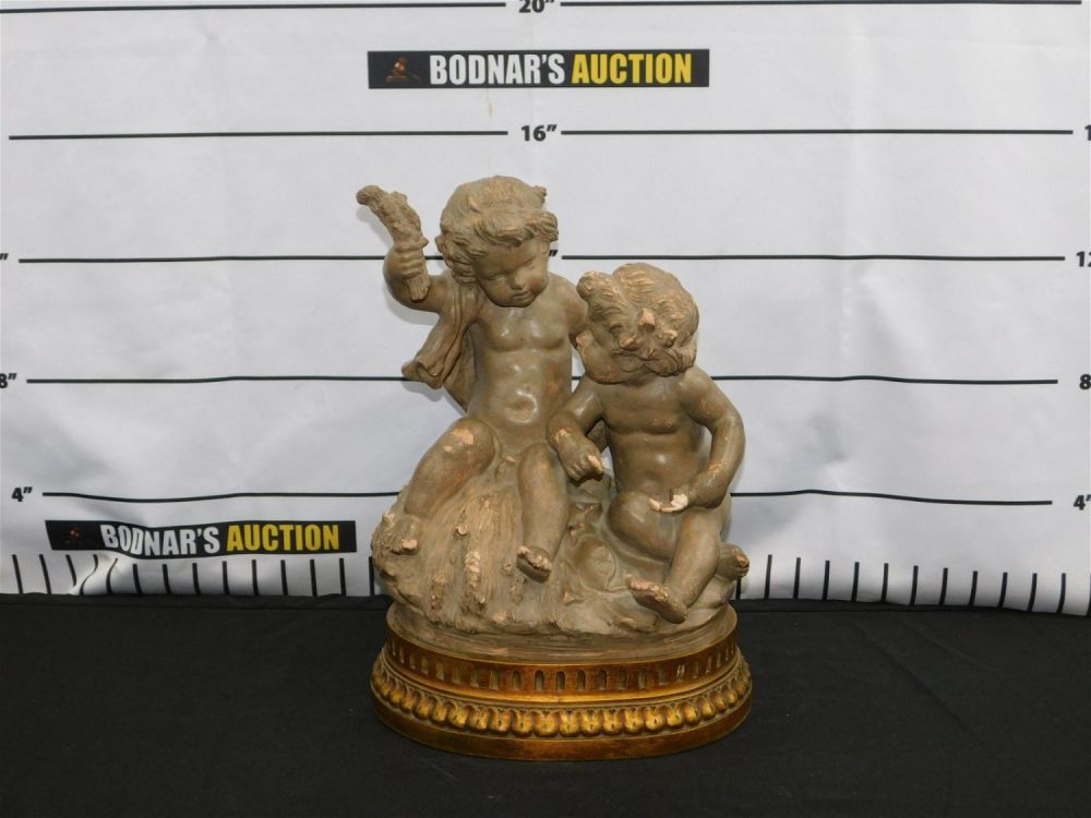 Lot 162: 19th Century Terra Cotta Cherub Figurine