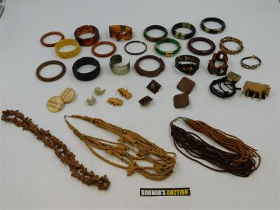 Lot of Costume Jewelry. Including bangles, Necklaces, and Earrings. Mostly Lucite and Wood. 