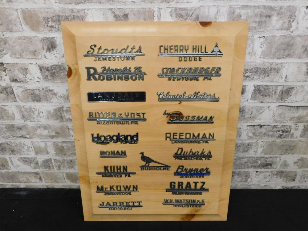 Lot 239: Collage of Car Dealership Name Plates