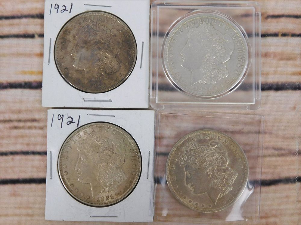 Lot 238: 4 1921 P Morgan Silver Dollars