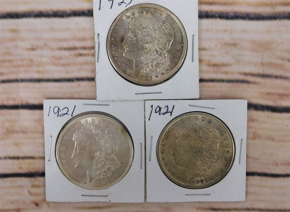 Lot 240: 3 1921 P Morgan Silver Dollars
