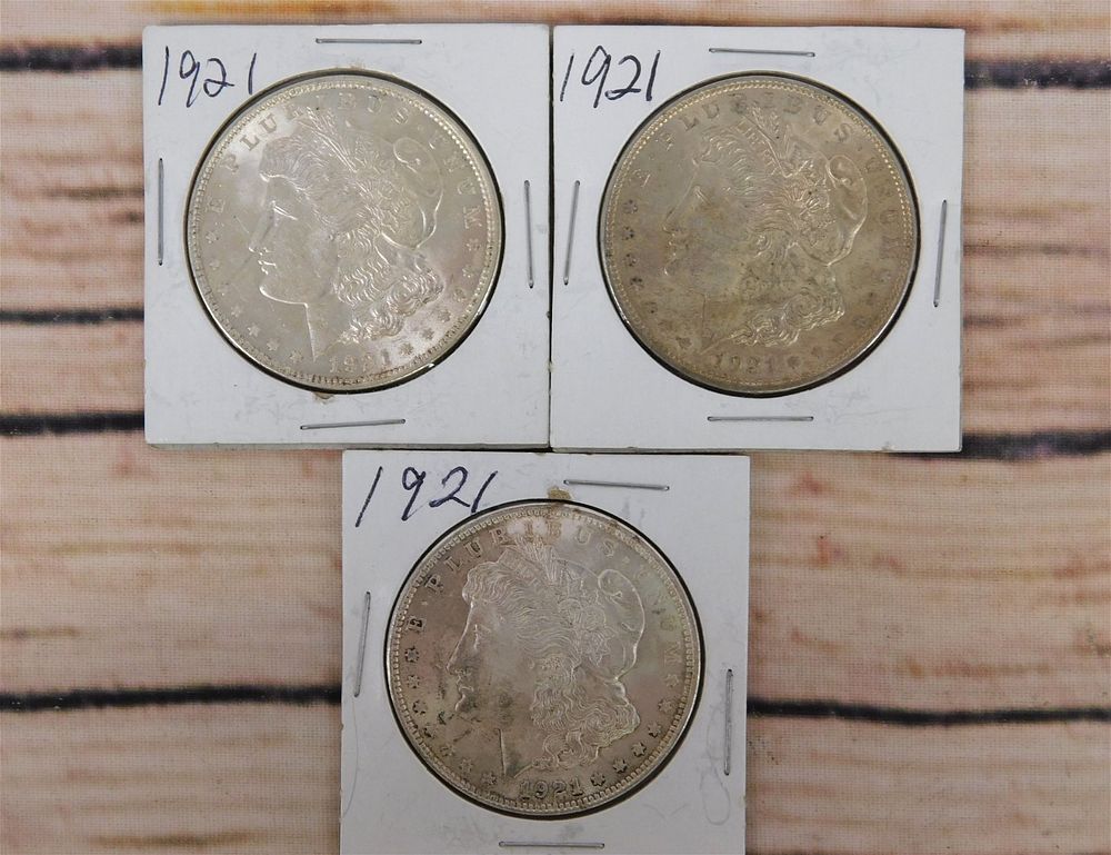 Lot 241: 3 1921 P Morgan Silver Dollars