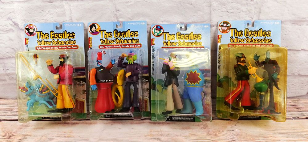 Lot 178: Set of 4 The Beatles Sgt. Peppers Lonely Hearts Club Band Figures