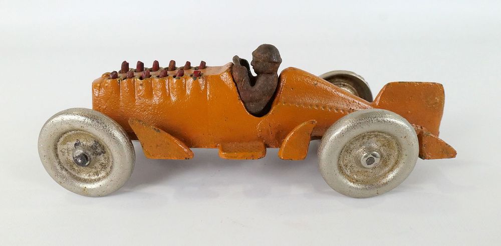 Lot 186: Cast Iron Mechanical Piston Toy Race Car