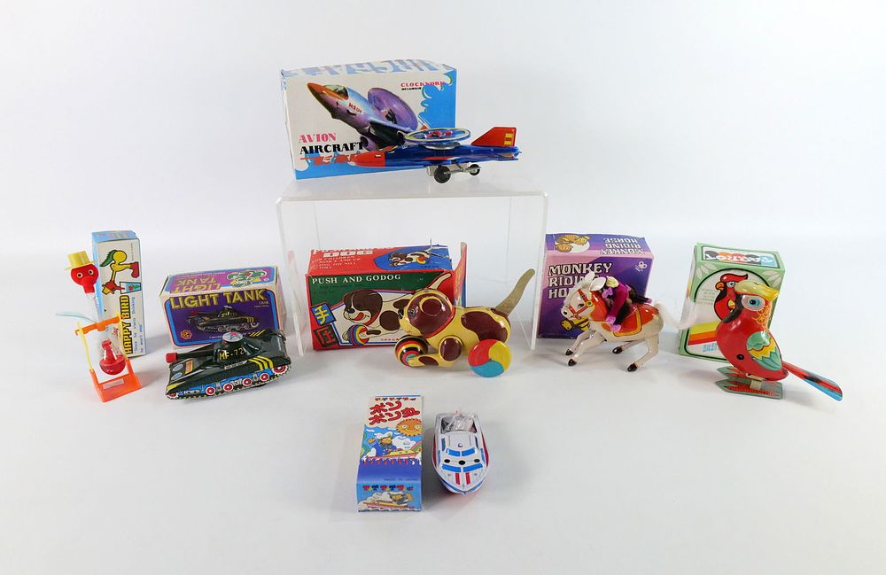 Lot 211: Group Lot of Vintage Tin Friction and Key Wind Toys