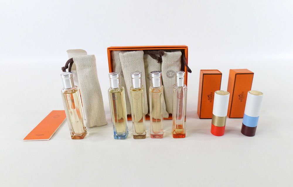 Lot 377: Group Lot of Hermes Travel Perfumes and Lipsticks