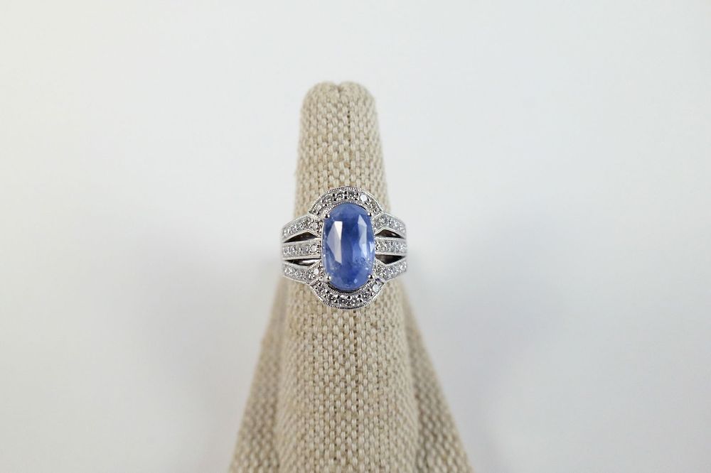 Lot 205: Platinum Sapphire and Diamond Ring