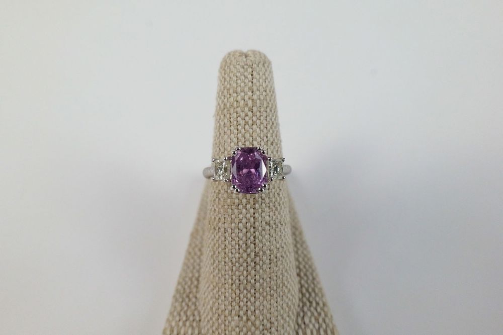 Lot 210: Platinum Sapphire and Diamond Ring