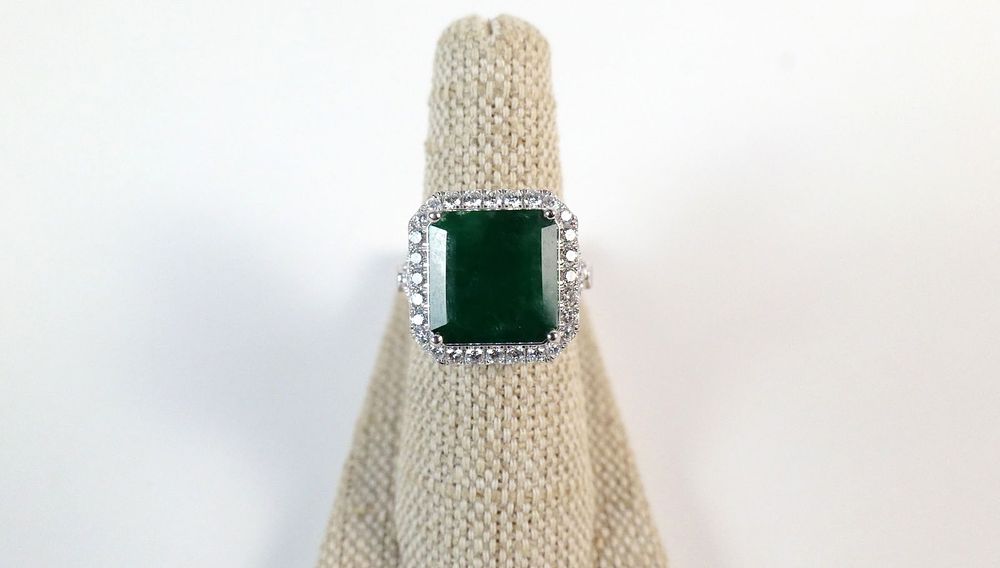 Lot 325: Platinum Emerald Beryl and Diamond Ring