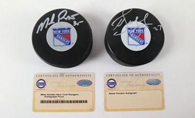 Lot of 2 New York Rangers Autographed Hockey Pucks. Including Mike Richter and Alexei Kovalev. 