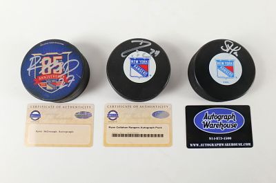 Lot of 3 New York Rangers Autographed Hockey Pucks. Including Ryan McDonagh 85th Anniversary 