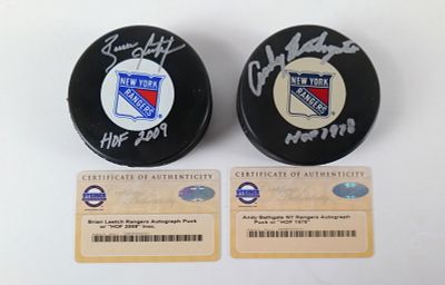 Lot of 2 New York Rangers HOF Inscribed Autographed Hockey Pucks. Including Andy Bathgate "HOF 
