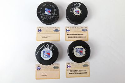 Lot of 4 New York Rangers Autographed Hockey Pucks. Including Mats Zuccarello, Marc Staal 