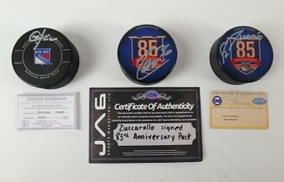 Lot of 3 New York Rangers Autographed Hockey Pucks. Including Mats Zuccarello 85th Anniversary 