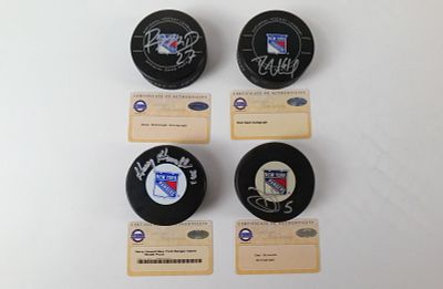 Lot of 4 New York Rangers Autographed Hockey Pucks. Including Harry Howell Game Model Puck, Dan 