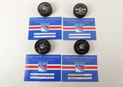 Lot of 4 New York Rangers Autographed Hockey Pucks. Including Marian Gaborik, Brad Richards 