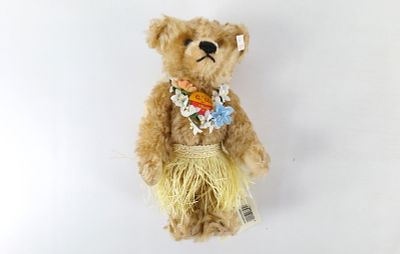 Steiff Hawaiian Girl Mohair Bear. Dated 1998. Measures 10" long. Comes with tag and ear tag.