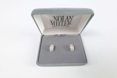 Pair of Rhinestone Half Hoop Studs by Nolan Miller. The lot includes a pair of domed silver 