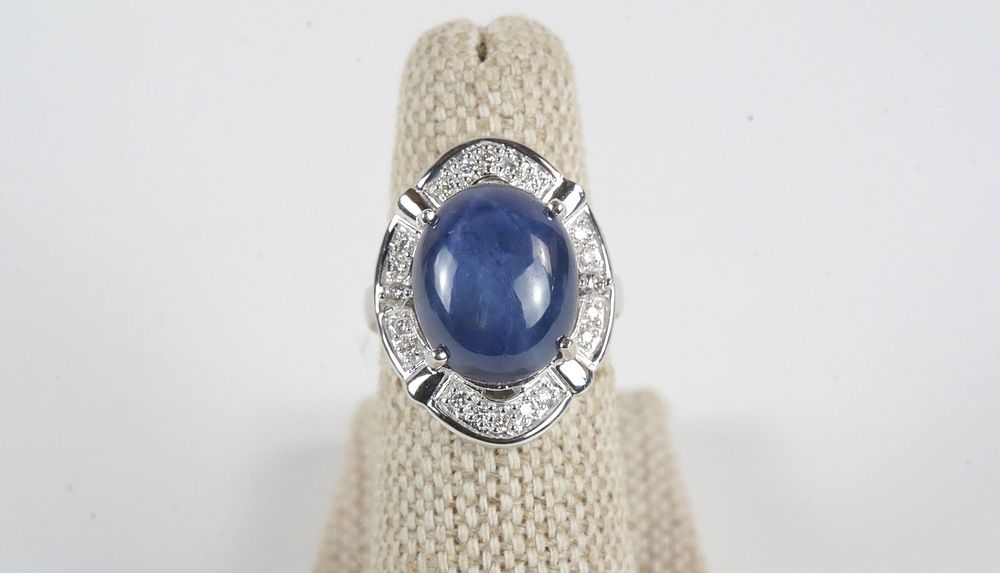 Lot 379: 14K White Gold Blue Star Sapphire and Diamond Ring