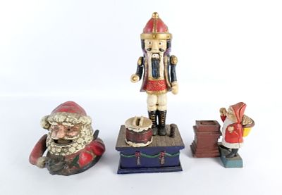 Lot of 3 Vintage Reproduction Cast Iron Christmas Banks. Including Nutcracker, and 2 Santa 