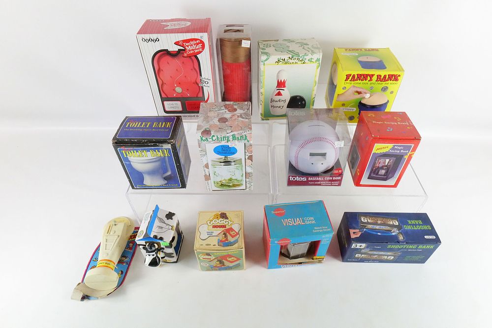 Lot 199: Lot of 13 Novelty Banks - In Original Boxes