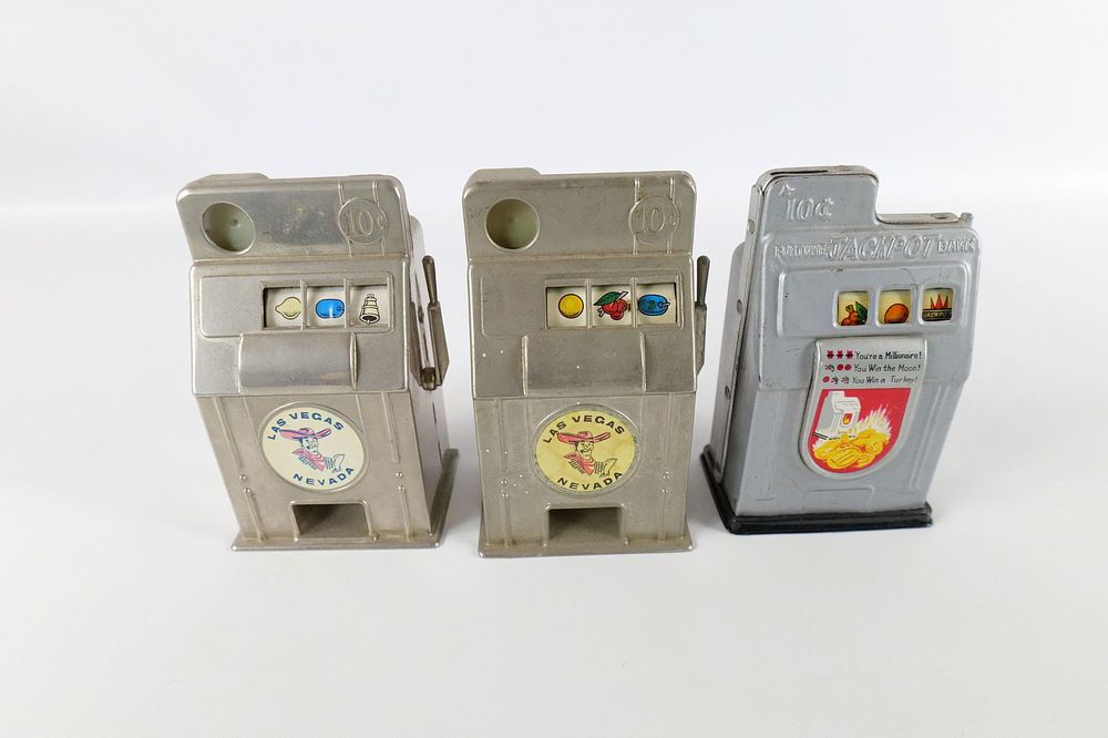 Lot 220: Lot of 3 Metal and Tin Litho Slot Machine Banks