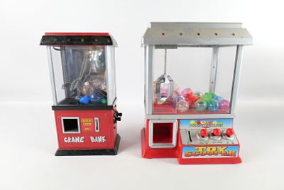 Lot of 2 Claw Style Arcade Games. Both come with a couple toys inside. Tallest measures approx. 