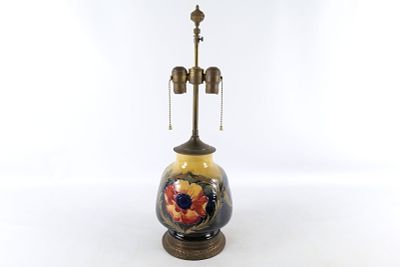 Moorcroft Pottery Table Lamp. William Moorcroft Pottery Table Lamp. Measures 24" tall x 8" wide. 