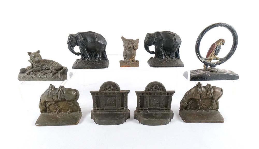 Lot 213: Group Lot of Cast Metal Book Ends, Doorstops, and Paperweights