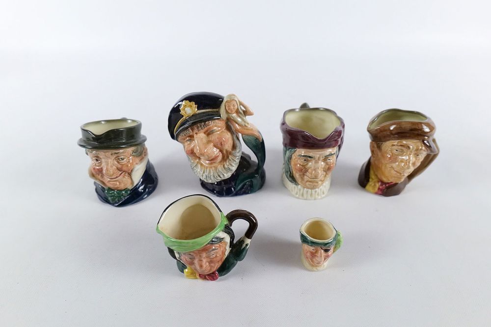Lot 237: Lot of Royal Doulton Toby Mugs