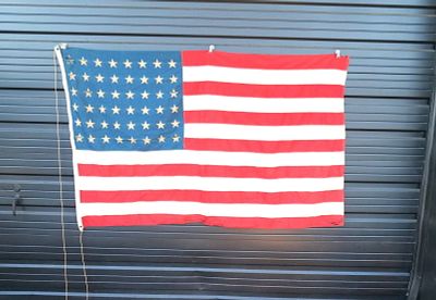 48 Star Flag. Multiple tears present. Staining also Present. All invoices must be paid within 