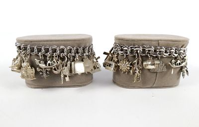 Lot of 2 Charm Bracelets. Including 2 Silver tone Bracelet with 9 Charms marked 800 Silver. 