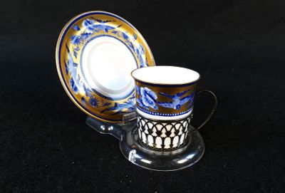 Shelley Bone China Demitasse Cup with Underplate. Cup has a Sterling Openwork Handled Holder. 