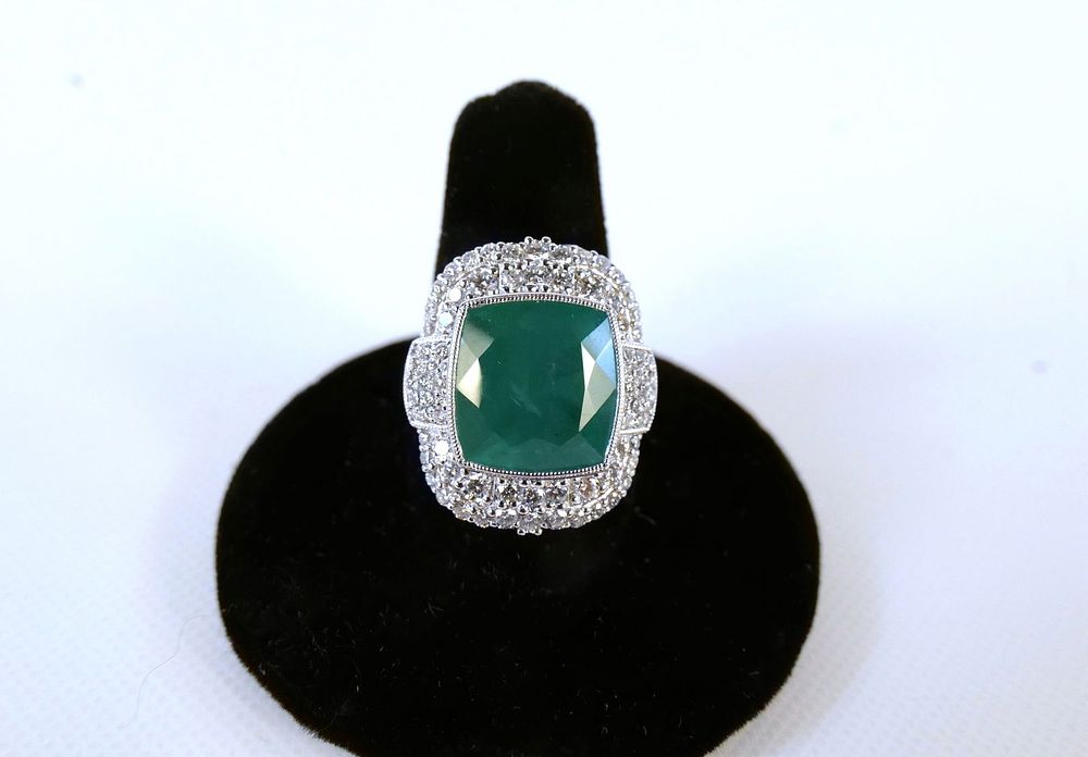 Lot 153: Platinum Emerald and Diamond Ring