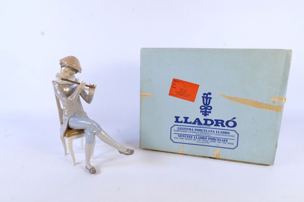 Lot 170: Lladro Boy Playing Flute Figurine