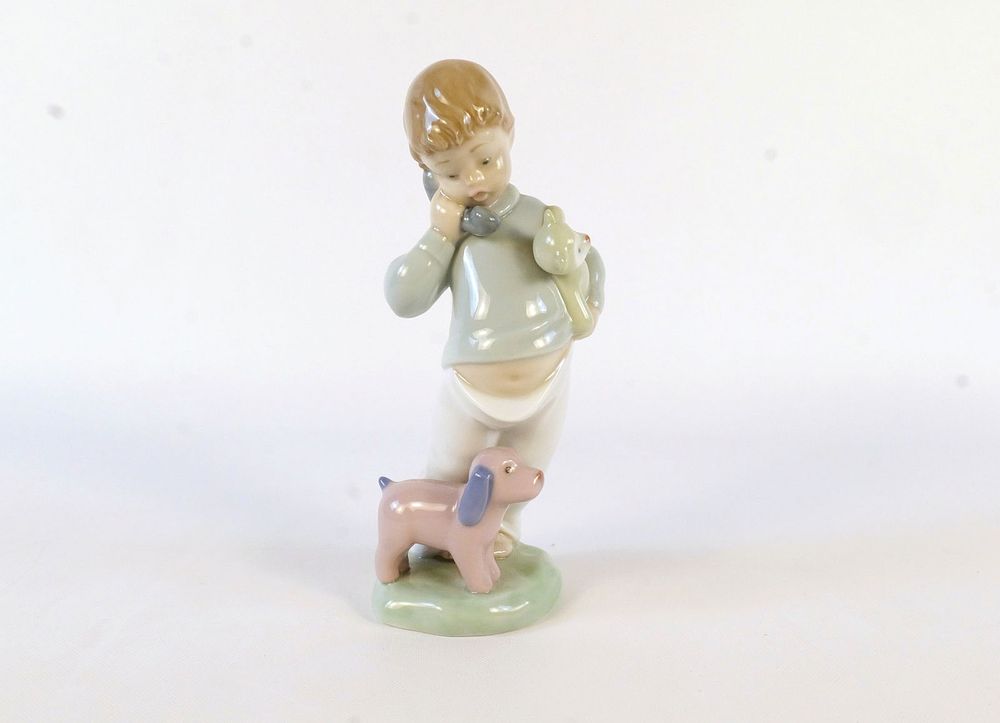 Lot 175: NAO Boy on Phone Figurine