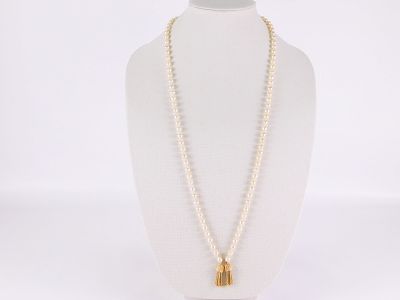 14k & Pearl Necklace. 14k &amp; Pearl Necklace. A String of Baroque 6.9 mm pearls with 2 14k 