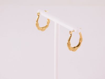 Pair of 14k Yellow Gold Hoop Style Earrings. Has an etched style with a scalloped edge. 