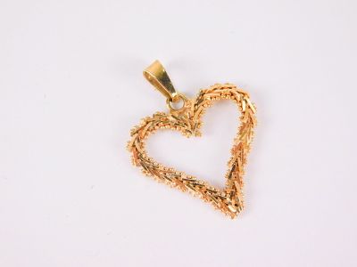 14k Heart Pendant. Done in a wire filagree link style with granulated beads on either edge. 