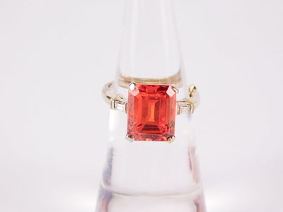 14k White Gold Ring. Has a 10.9 x 8.8 mm emerald cut lab created ruby or possible red spinel 